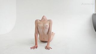 Clothed flexible dark haired Alla Sinichka