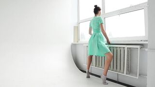 Clothed flexible dark haired Alla Sinichka