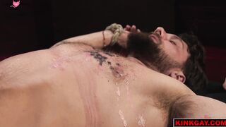 Crush and drips hot wax over Heath on his back