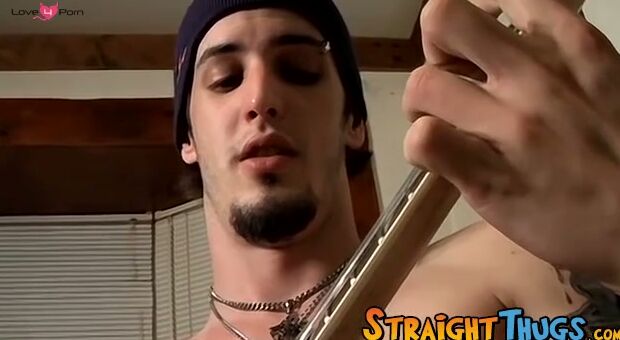 Horny straight thug Axel plays with the guitar and his cock