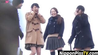 NipponPissTV.com - Kinky schoolgirls from Japan hold each other and pee outside openl