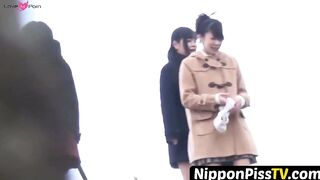 NipponPissTV.com - Kinky schoolgirls from Japan hold each other and pee outside openl