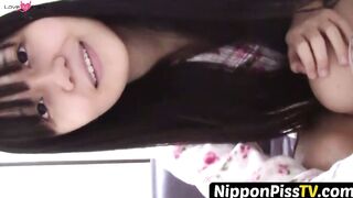 NipponPissTV.com - Naughty Japanese teen pees in a cup while putting makeup on indoor