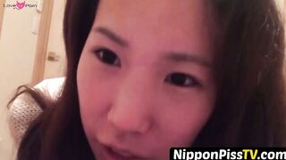 NipponPissTV.com - Japanese chick wakes up and pees in a jar while on the floor indoo
