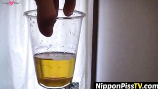 NipponPissTV.com - Kinky Japanese babe plays with her cat after peeing in cups indoor