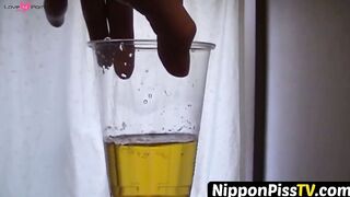 NipponPissTV.com - Kinky Japanese babe plays with her cat after peeing in cups indoor