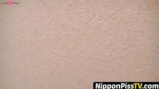 NipponPissTV.com - Kinky Japanese babe plays with her cat after peeing in cups indoor