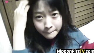 NipponPissTV.com - Kinky Japanese babe plays with her cat after peeing in cups indoor