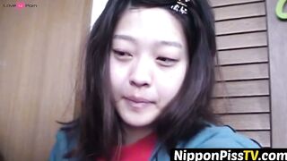 NipponPissTV.com - Kinky Japanese babe plays with her cat after peeing in cups indoor