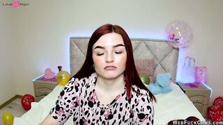 Big tits redhead strips to bra