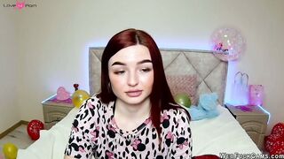 Big tits redhead strips to bra