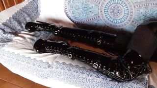 On a sofa wearing ebony goddess platform boots over the