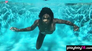Naked ebony MILF fingers her hairy pussy