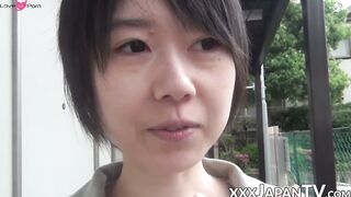 Young Japanese woman shows off butt and twat