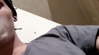 Tattooed Kyd Cash chainsmoking while working his cock in his boxer shorts