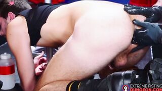 BDSM fisting with black gloves for submissive hunks