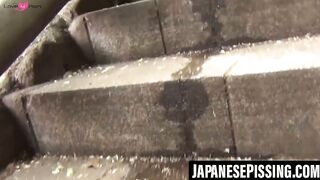 Japanese schoolgirl behaving naughtily while peeing outdoors