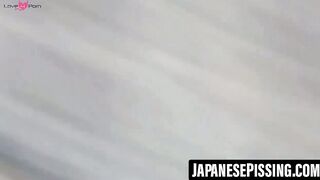 Japanese schoolgirl behaving naughtily while peeing outdoors