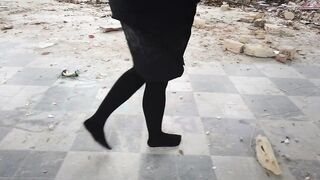 Blonde Lady Walks Then Hangs Her Legs While Sitting