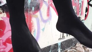 Blonde Lady Walks Then Hangs Her Legs While Sitting