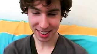 Twink strips and tugs on his huge dick in this classic video