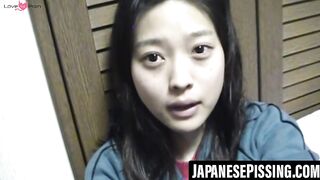 Japanese babe gets playfulness with her cat after pissing