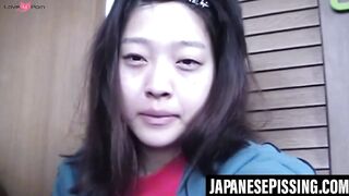 Japanese babe gets playfulness with her cat after pissing