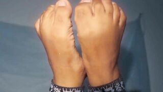 African mom showing off you with her great foot