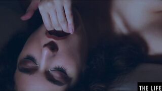 Rubbing her long puffy nipples as she fucks herself with