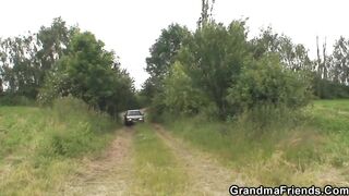 Mature old woman blows and riding outside