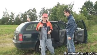 Mature old woman blows and riding outside