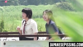 Two Japanese ladies compete to see who can pee the farthest