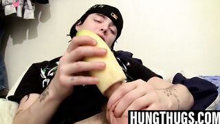 Thug uses cucumber to help stroke his stiff cock