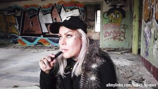 Blonde Lady Smokes An Electric Cigarette On Stairs