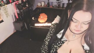 Goth Brunette in Polka Dot Dress Teases with Orange Dildo