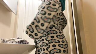 Brunette in Patterned Robe Brushing Teeth at Bathroom Sink