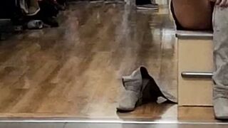 Brunette in White Shirt and Black Boots Unbuttons at Restaurant and Mall