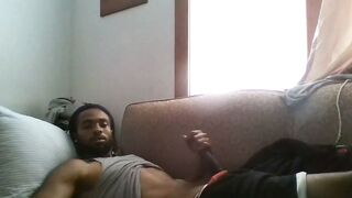 Black Man Masturbates on Couch Watching Porn