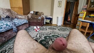 A dude jerks off a cock into front of his