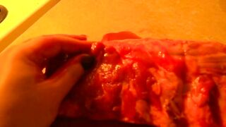 Rubbing the pig like he is a piece of meat