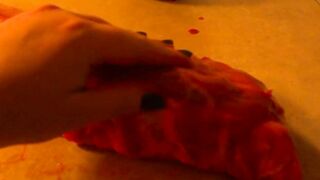 Rubbing the pig like he is a piece of meat