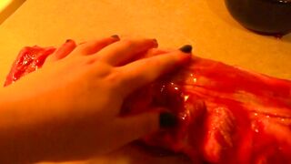 Rubbing the pig like he is a piece of meat