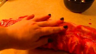 Rubbing the pig like he is a piece of meat