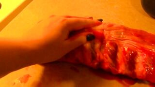 Rubbing the pig like he is a piece of meat
