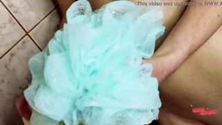 Stepsister caresses herself inside the shower