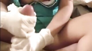Nurse gives rubber gloves hand job