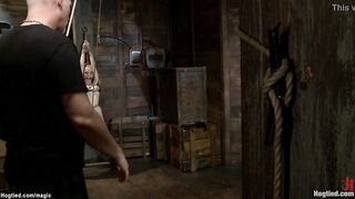 Blond suspended into the air on hogtied
