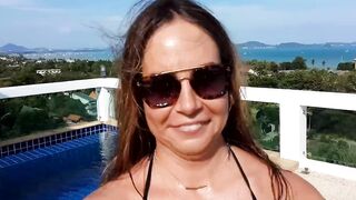 Huge boobied VividRedHead gets topless into penthouse terrace
