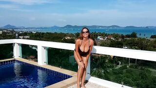 Huge boobied VividRedHead gets topless into penthouse terrace