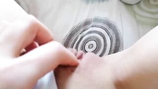 Rubbing her pink bald twat for me through her panties
